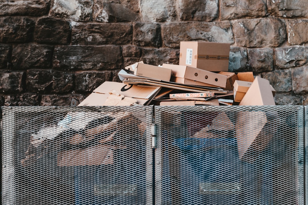 brown cardboard boxes on black steel frame