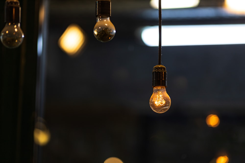 brown pendant lamp turned on in tilt shift lens