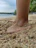 Close-up of Burnsea thongs drying after being splashed with water by a rocky shore.