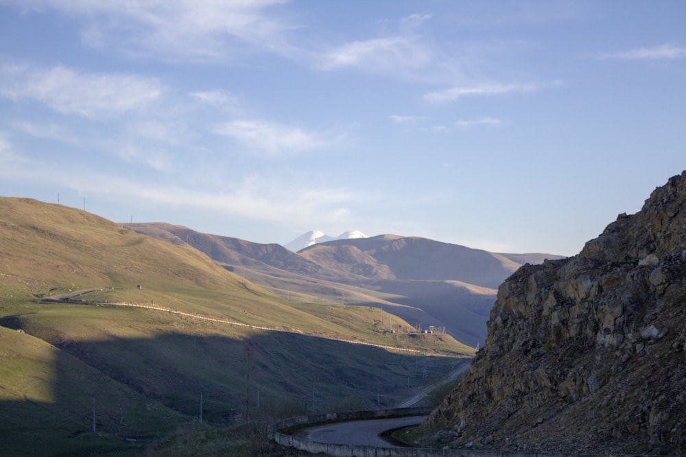 brown mountains under white clouds during daytime