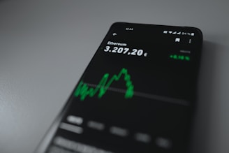 black samsung remote control on white table