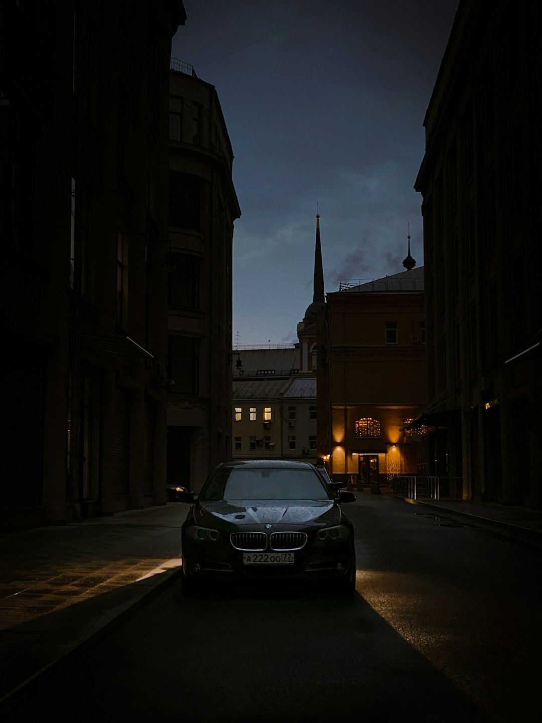 black car on road during night time