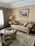 A beautifully decorated living room featuring products from Home Upgrade Goods.