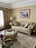 A beautifully decorated living room featuring products from Home Upgrade Goods.