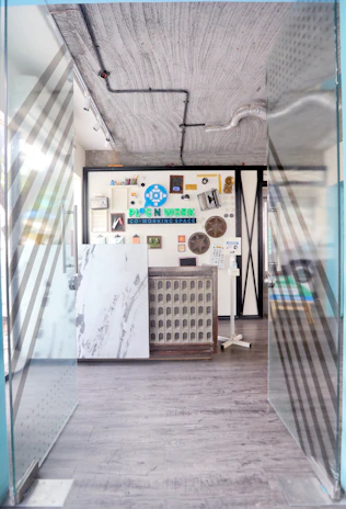 Private entrance to a multifunctional studio space with kitchen and support zones.