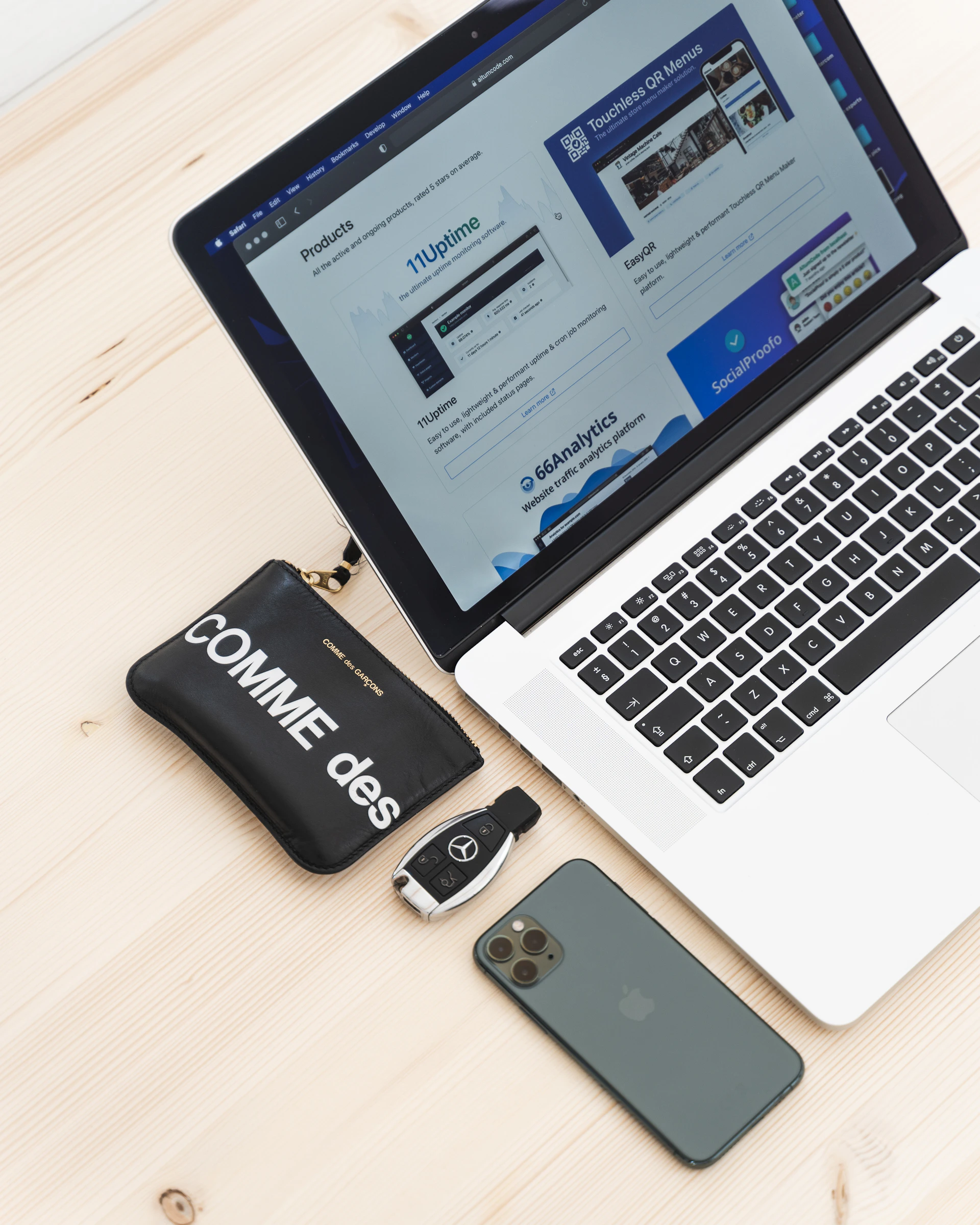 black iphone 5 beside macbook pro