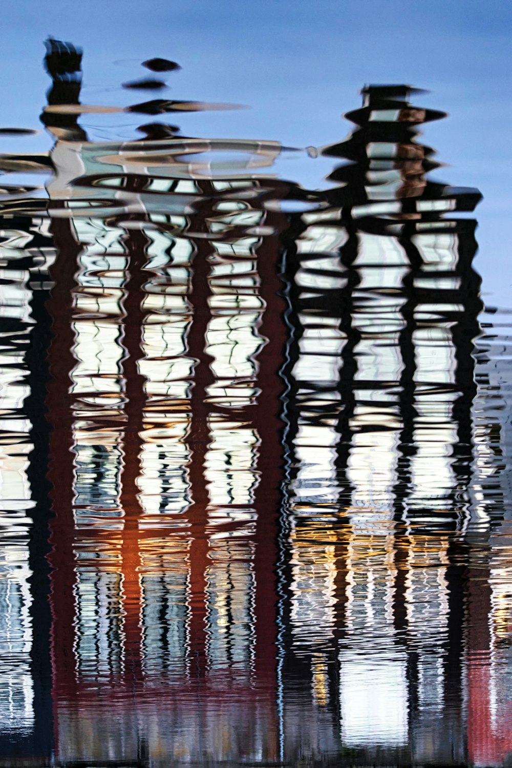 red and white lights reflecting on water