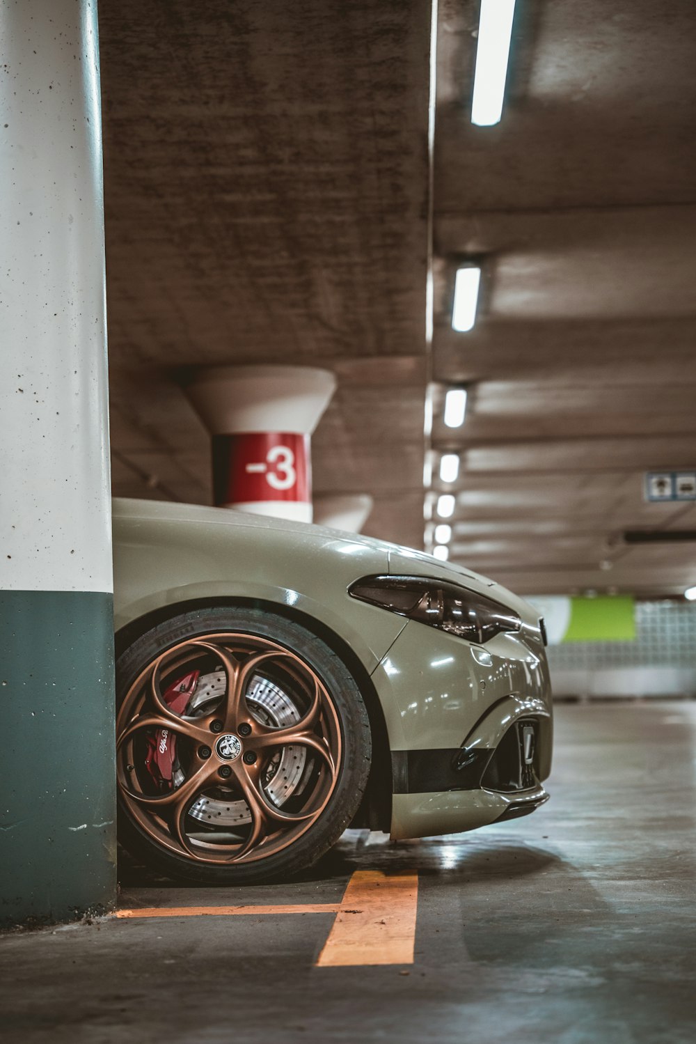 silver porsche 911 parked in garage