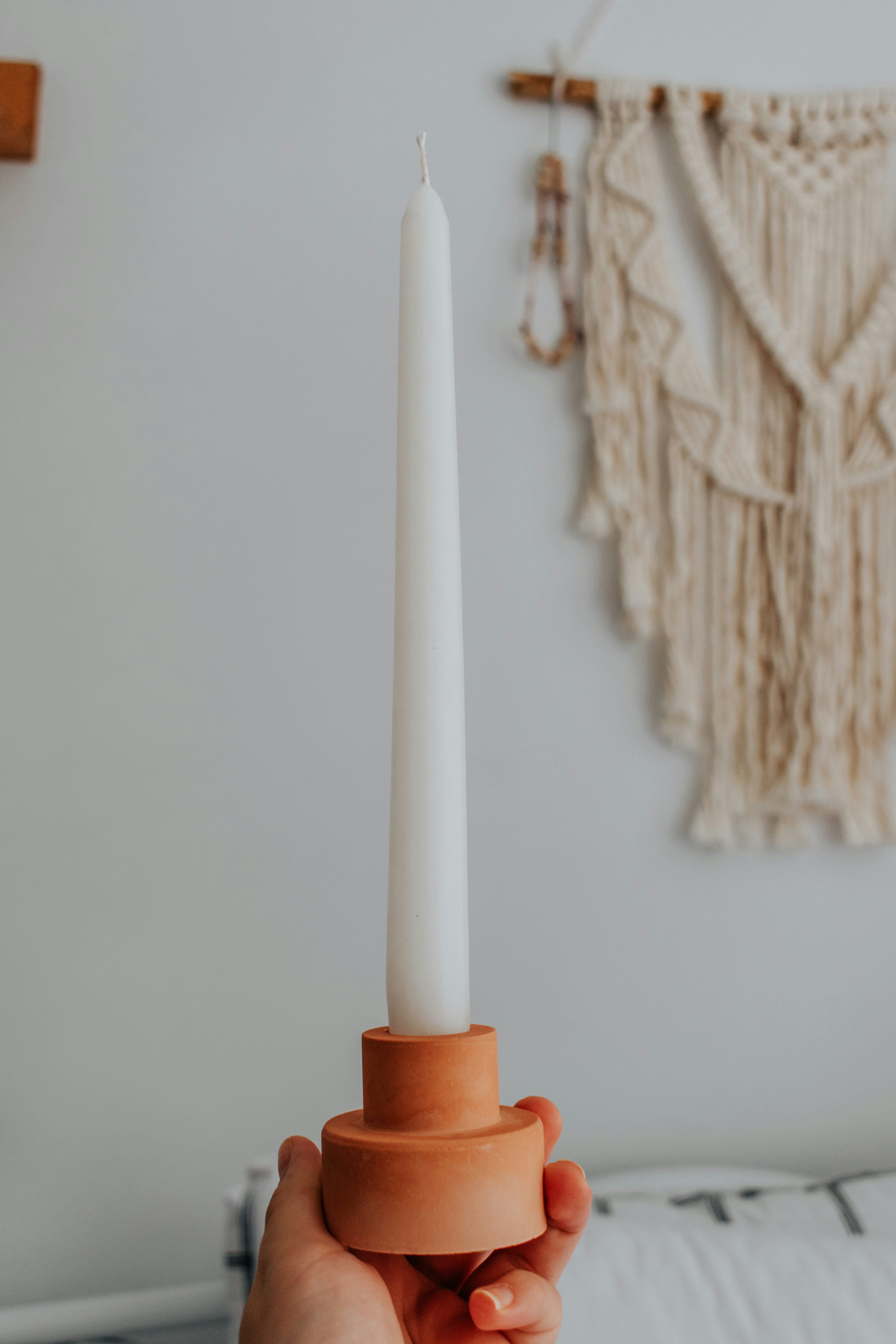 white and brown stick candle