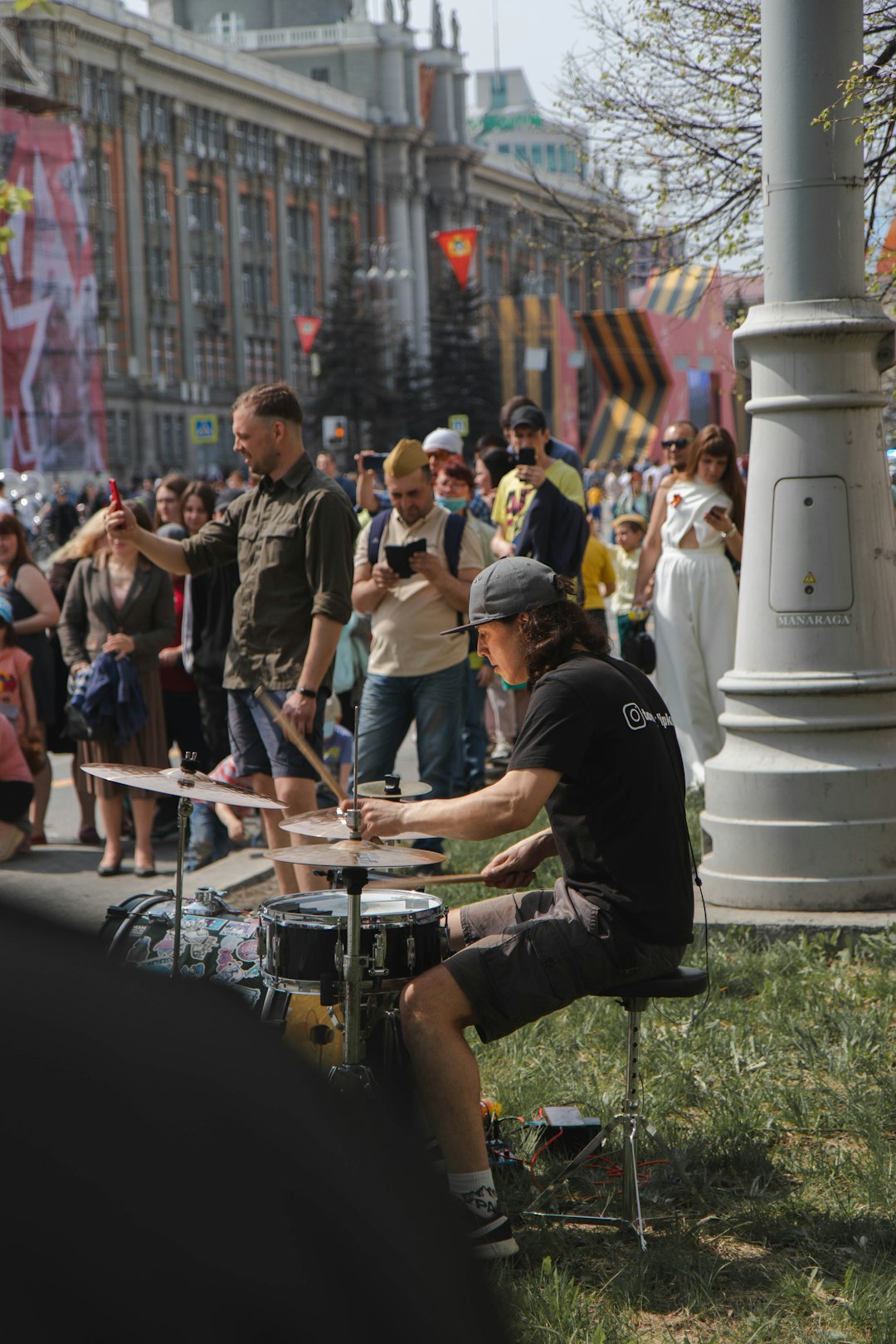 people playing musical instruments on street during daytime