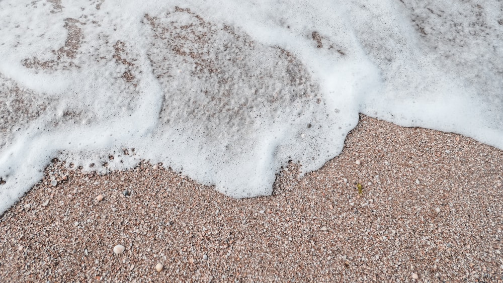 white and brown sand on brown sand