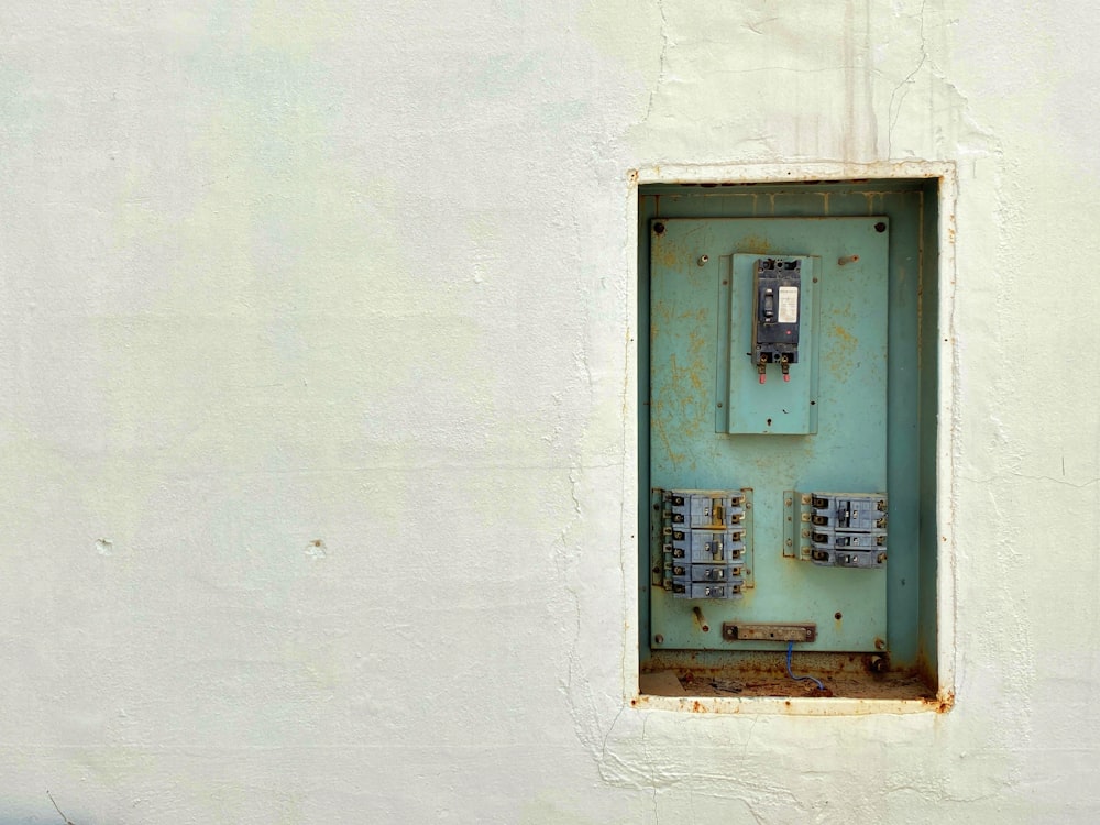 gray and white wall mounted telephone