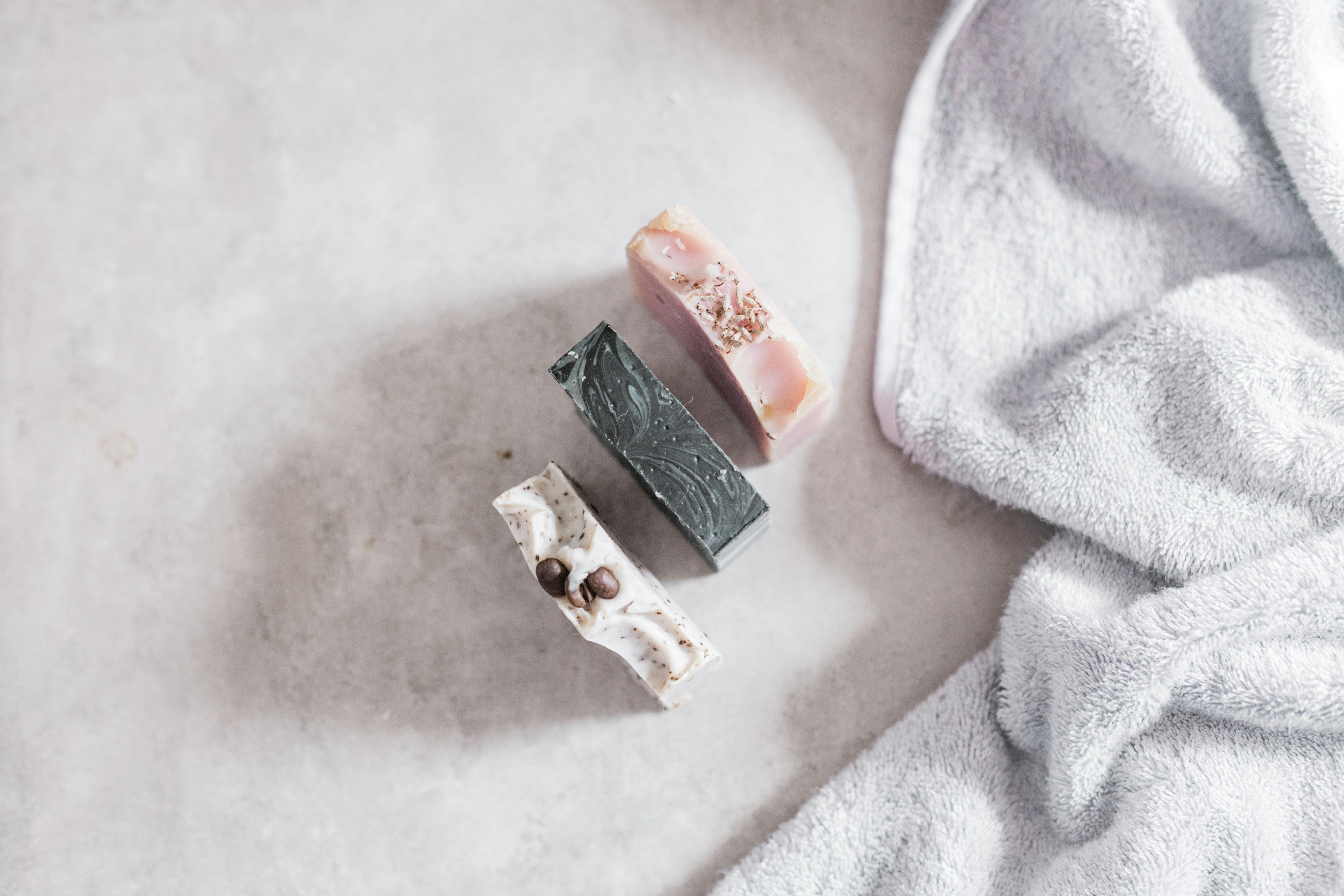 white and black soap on white textile