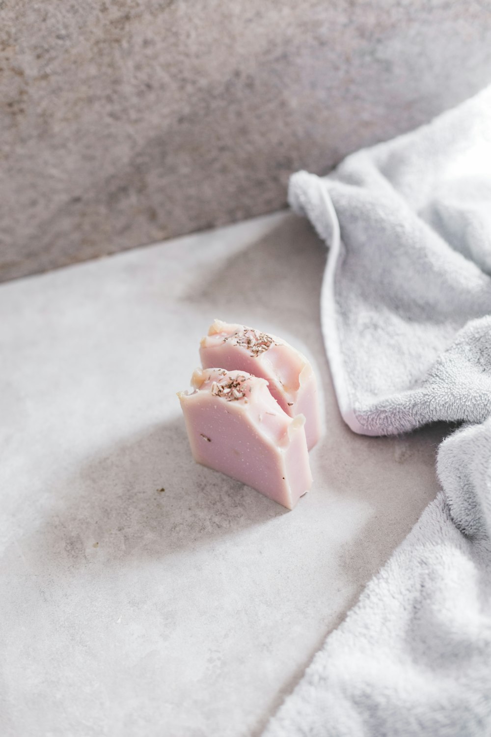 pink and white icing on white towel