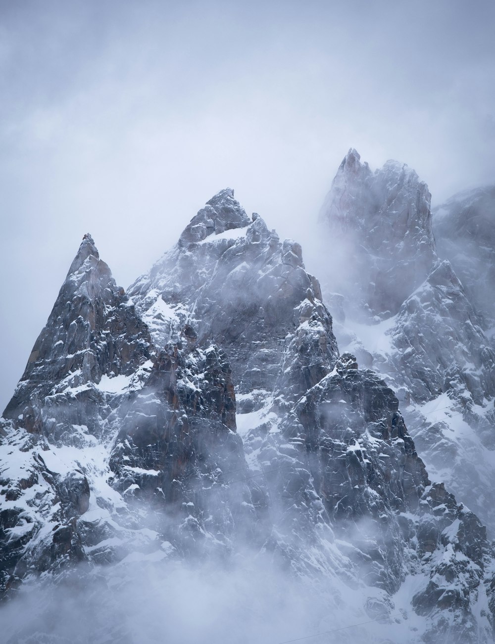 snow covered mountain during daytime