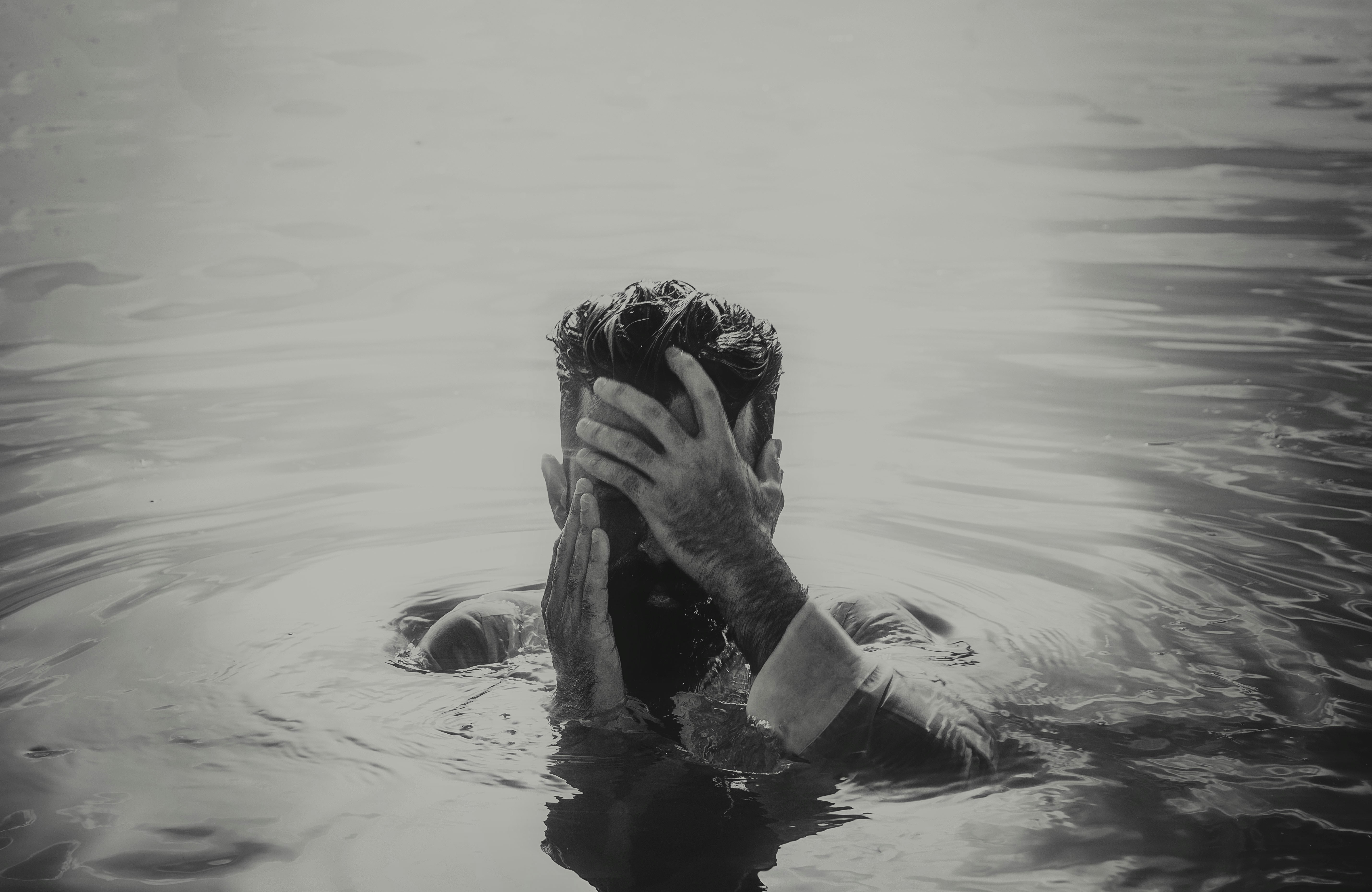 Woman in water covering her face photo – Free Grey Image on Unsplash
