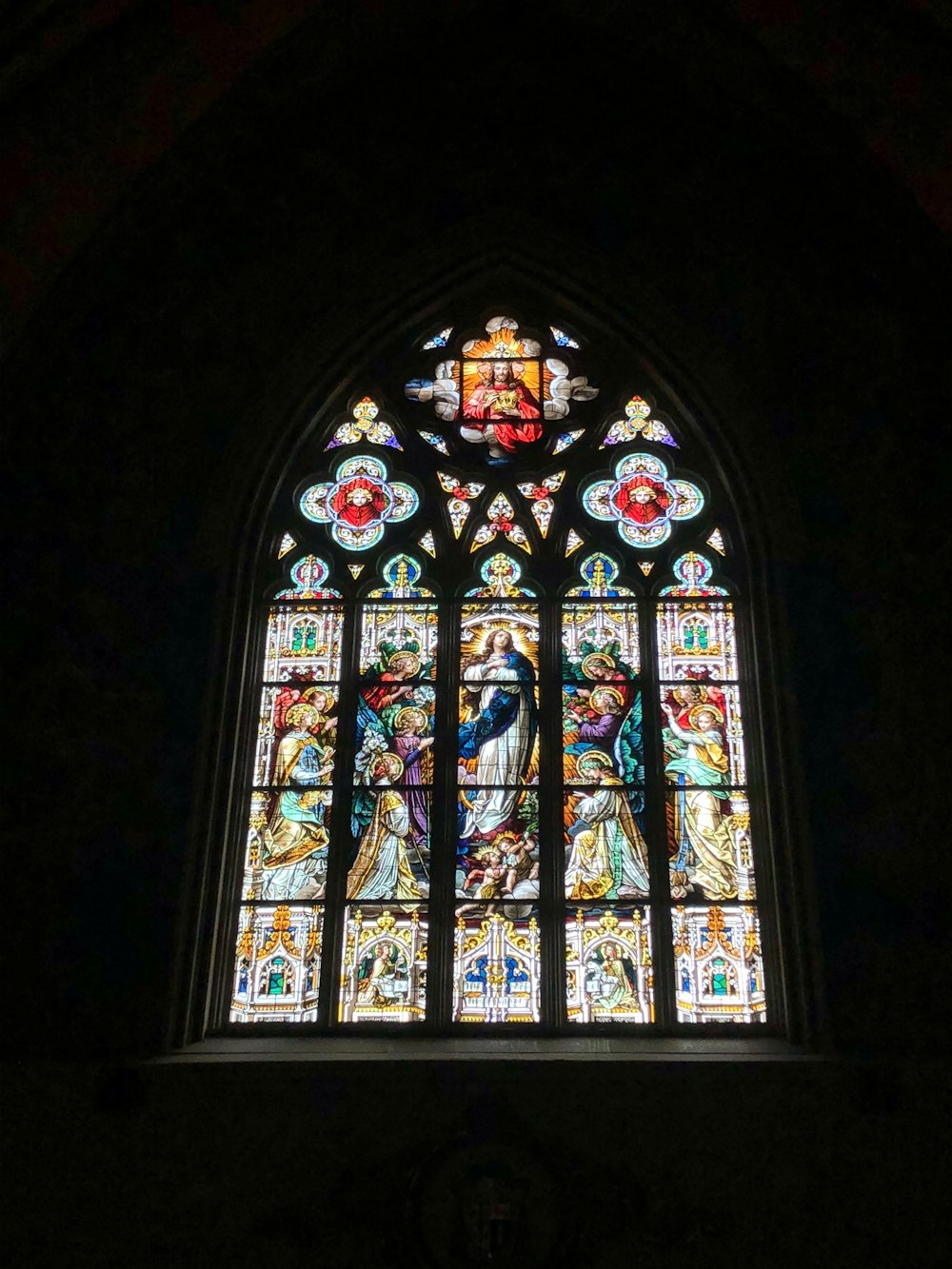 red blue and yellow floral glass window