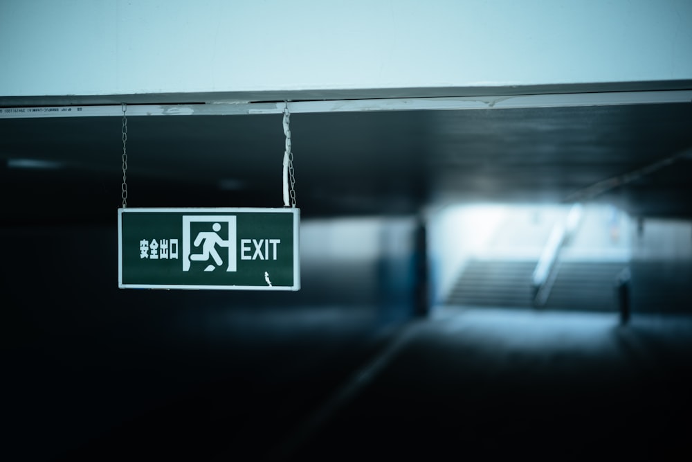 white and black exit sign