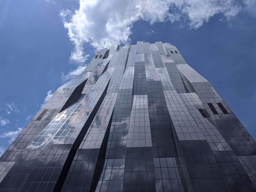 low angle photography of high rise building under blue sky during daytime