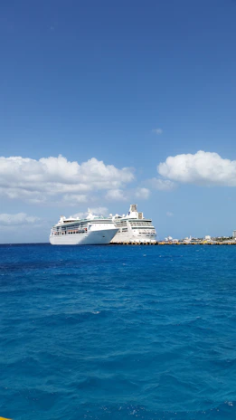 A vibrant photo of a family happily boarding a cruise ship under clear blue skies.