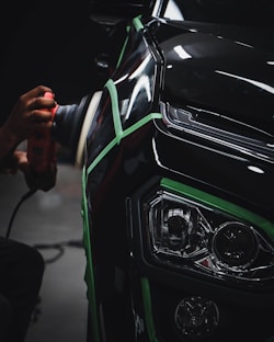 person holding car steering wheel