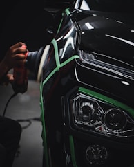 person holding car steering wheel