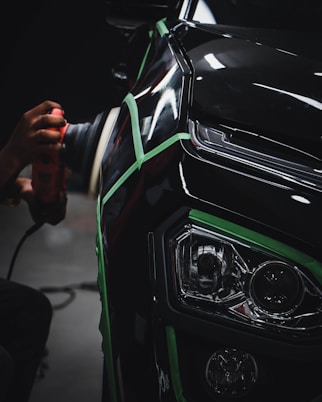 person holding car steering wheel