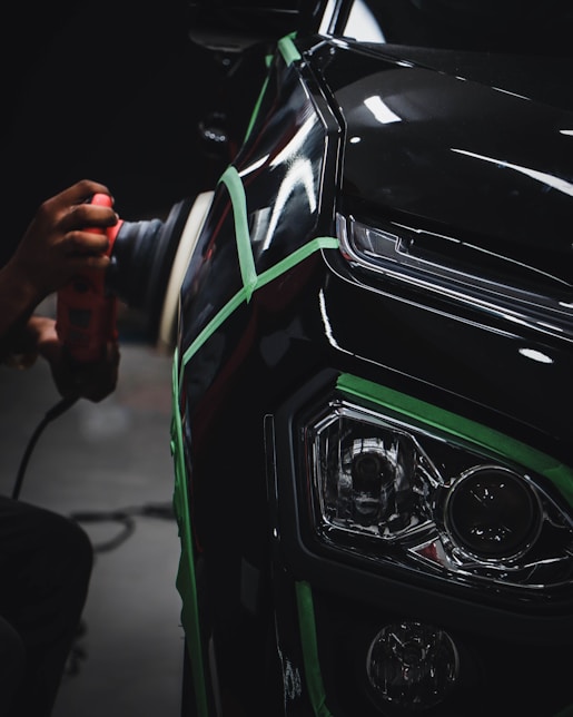 person holding car steering wheel