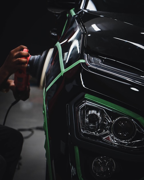 person holding car steering wheel