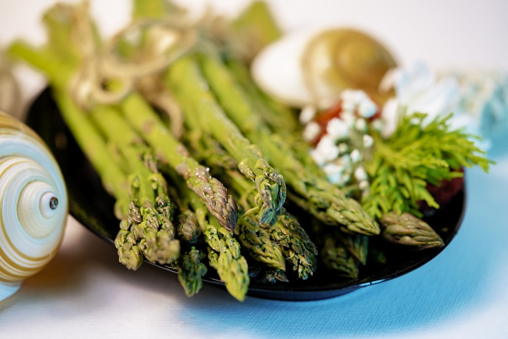 green vegetable on blue ceramic plate