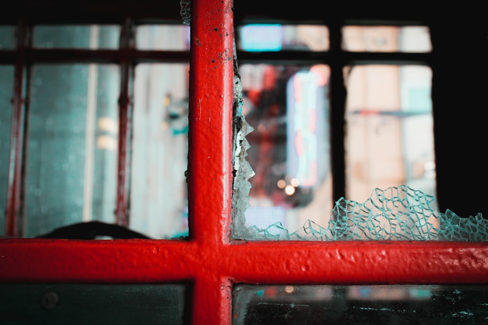 red wooden framed glass window