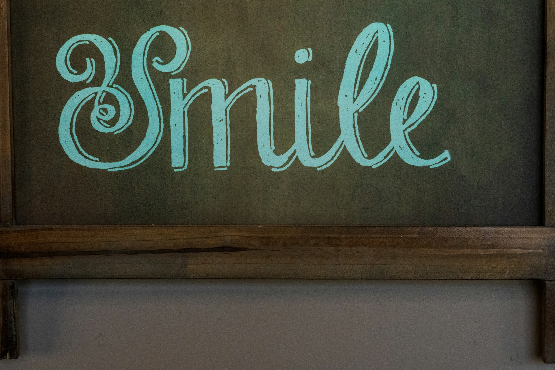brown wooden wall mounted signage