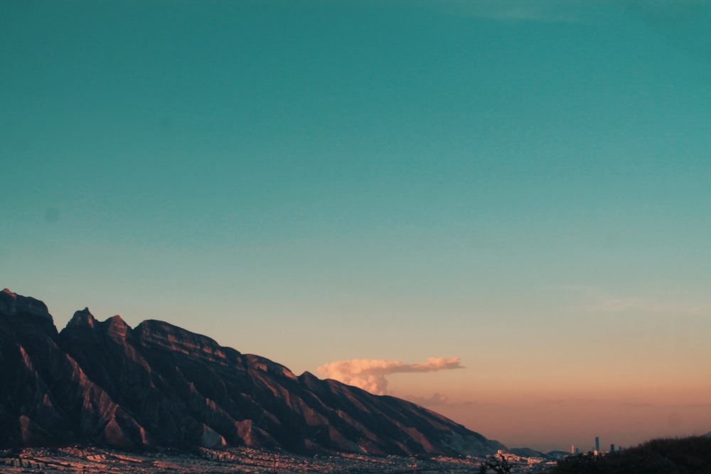 brown mountains under blue sky during daytime