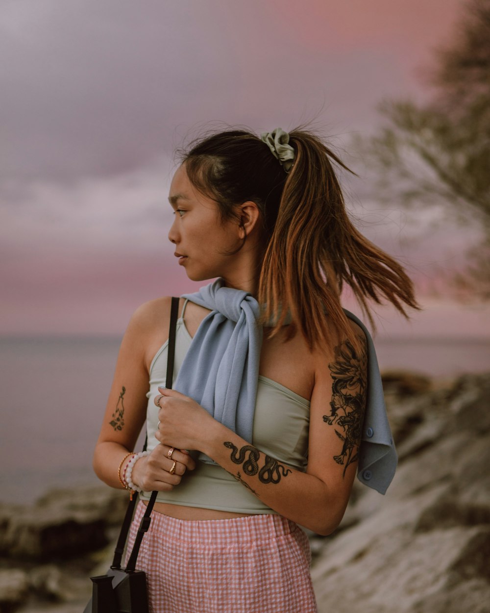 woman in blue and white plaid sleeveless dress