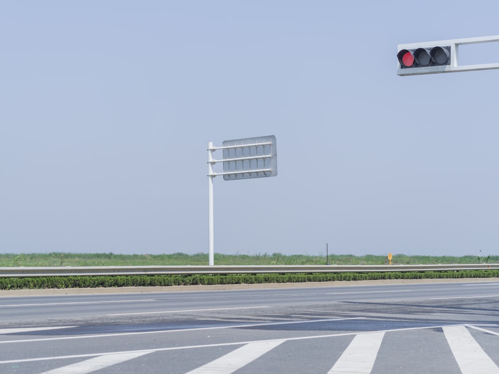 white and black basketball hoop on gray asphalt road during daytime