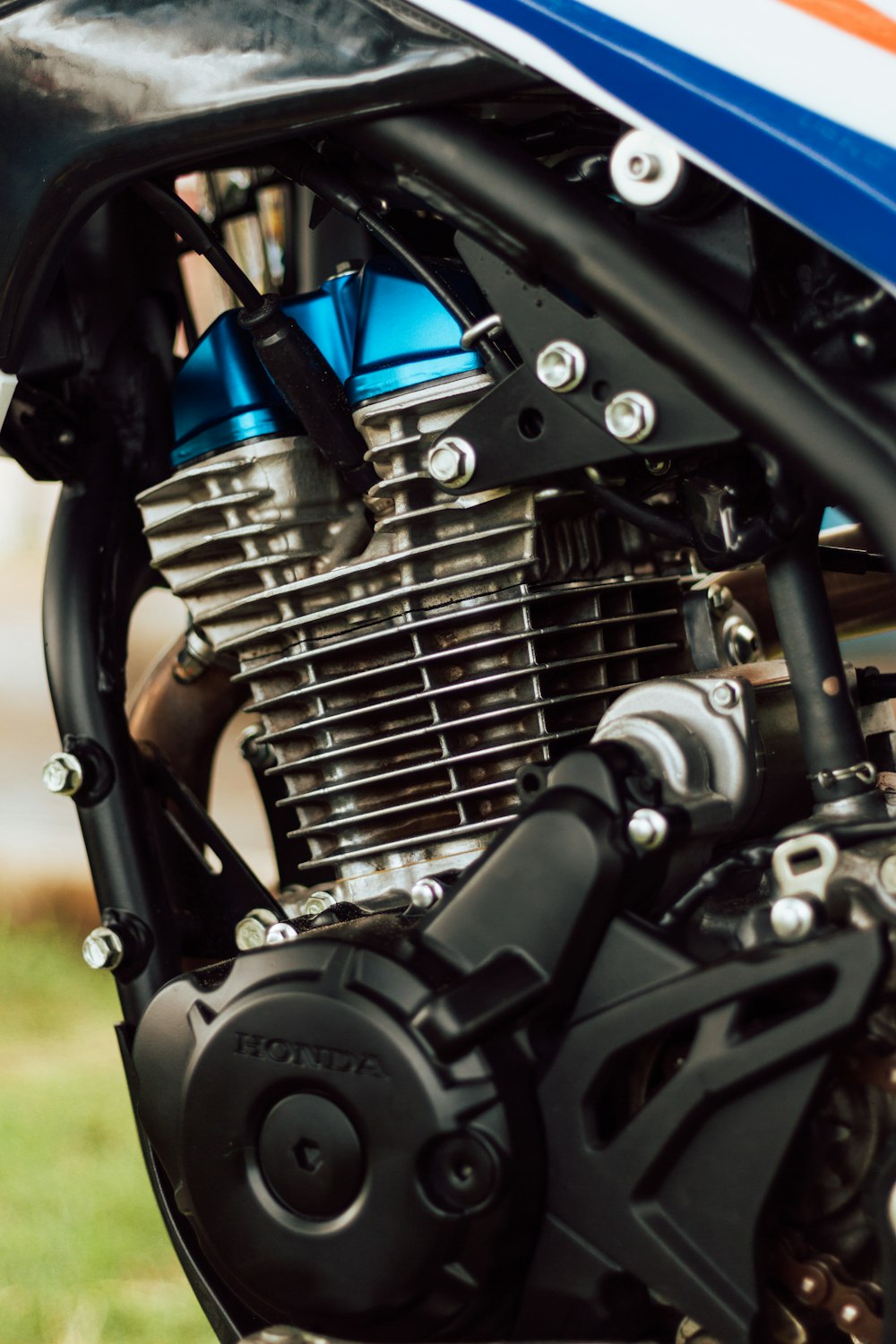 black motorcycle engine during daytime