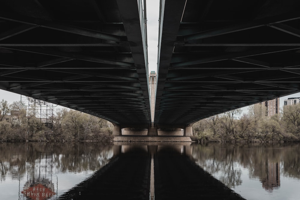 body of water under bridge during daytime