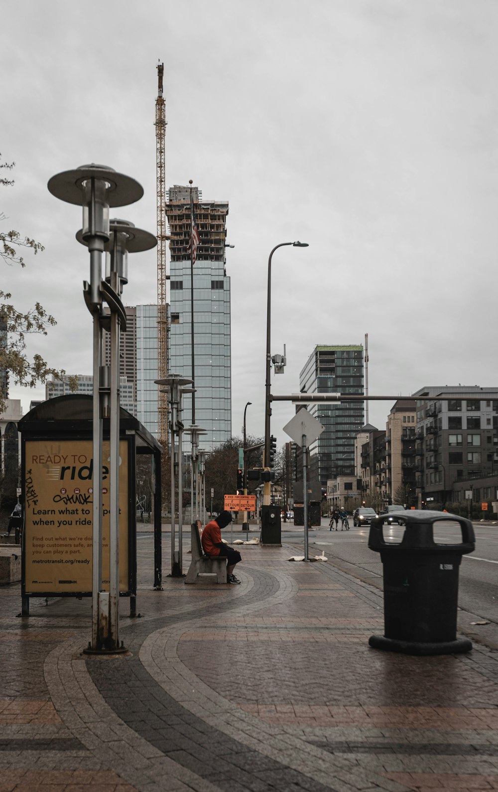 black street light near city buildings during daytime