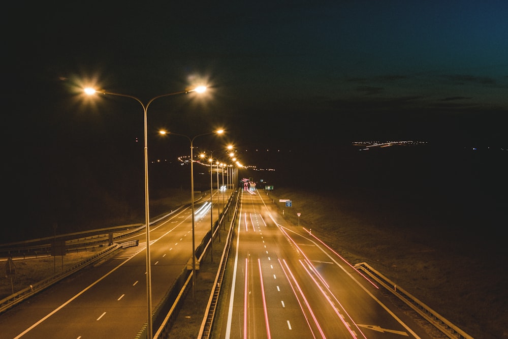 time lapse photography of cars on road during night time