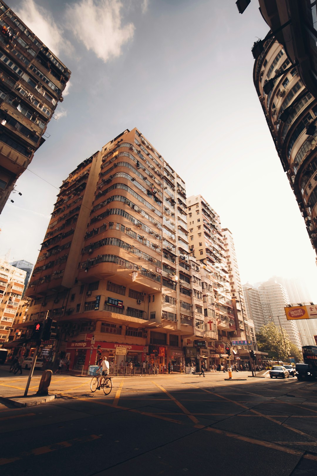 people walking on street near high rise buildings during daytime