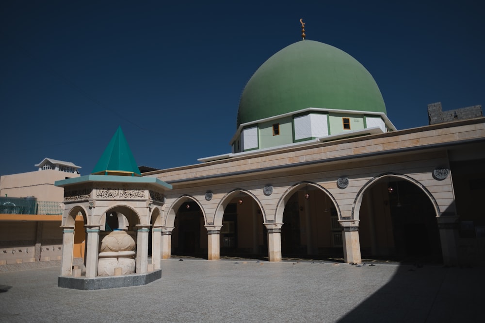 white and green dome building under blue sky during daytime