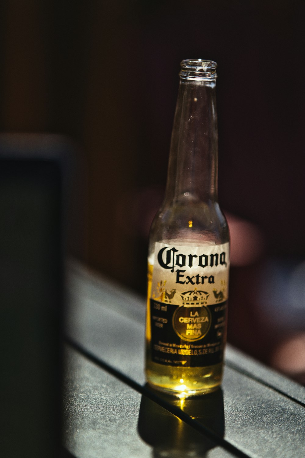 corona extra beer bottle on gray table
