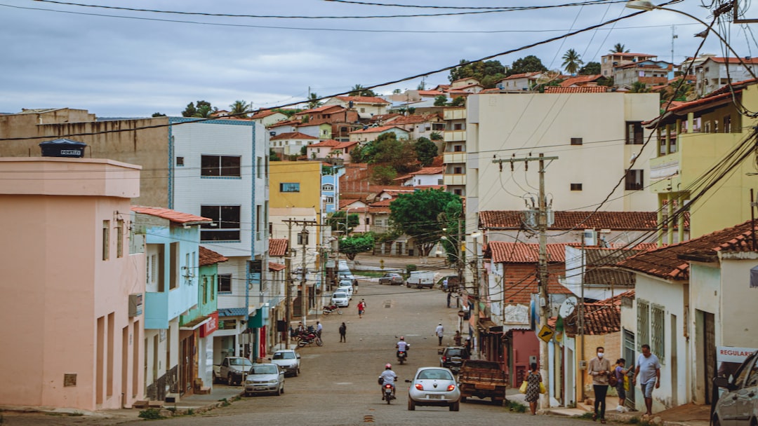 cars parked on street near buildings during daytime