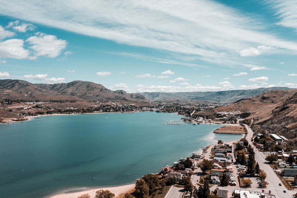 aerial view of city near body of water during daytime