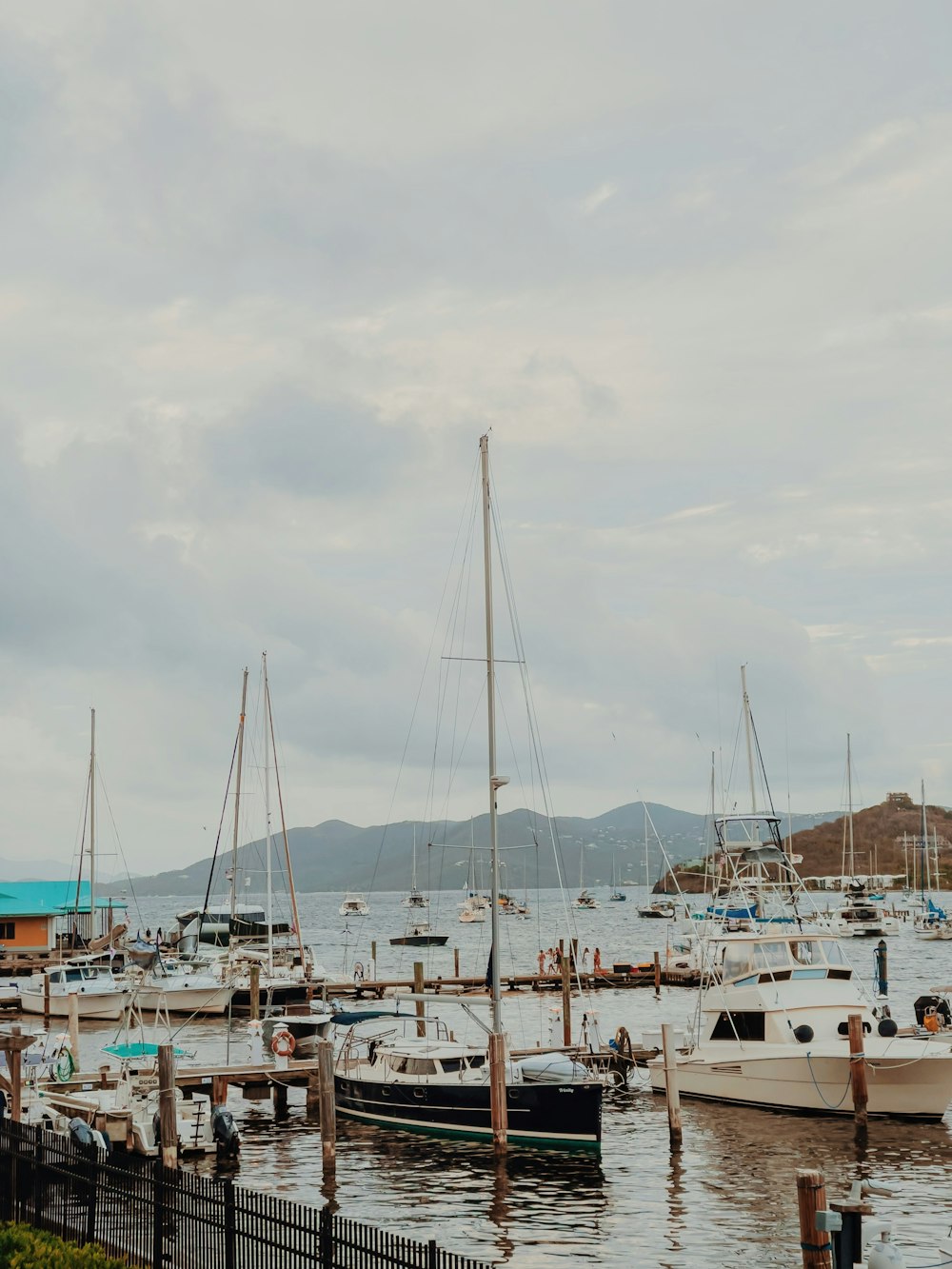 white sail boats on dock during daytime