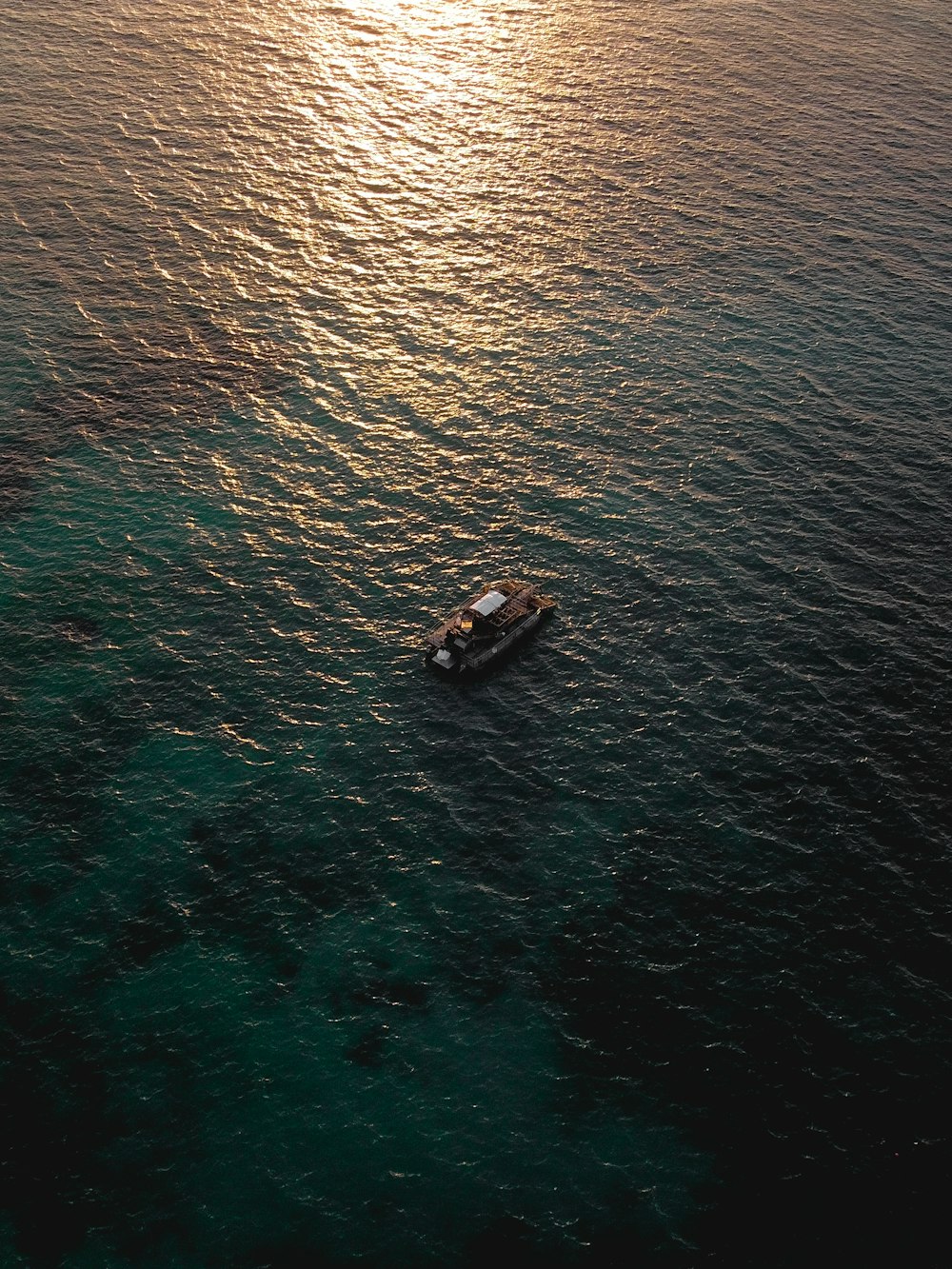 aerial view of boat on sea during daytime