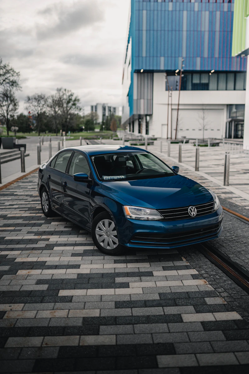 Blue sedan — fresh trade-in on the lot