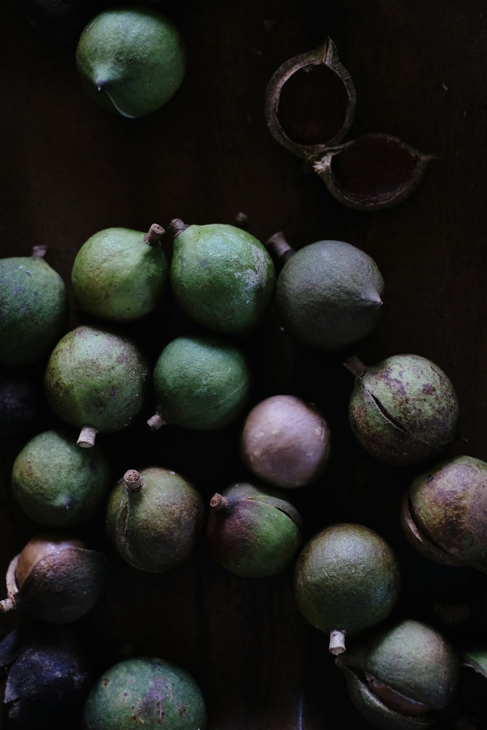 green and brown round fruits