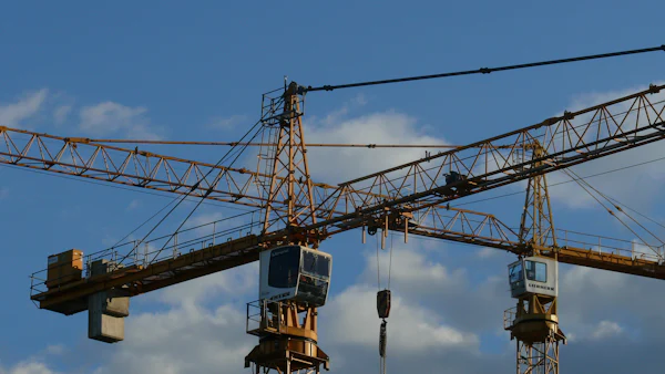Yellow and black tower crane undergoing load testing