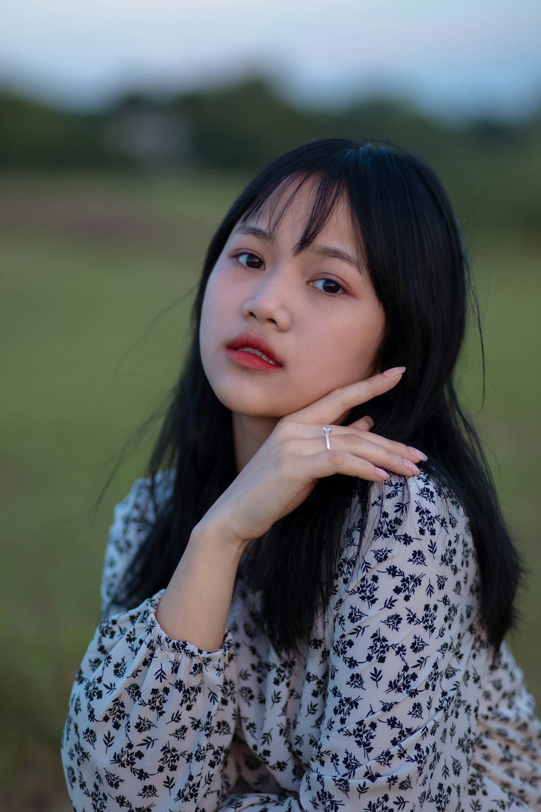 woman in white and black floral shirt